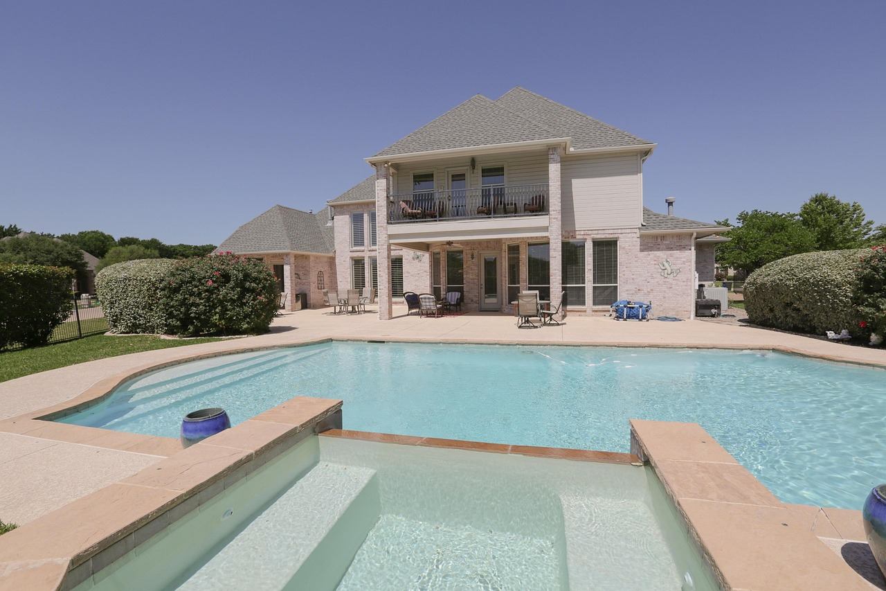 Sunny backyard swimming pool with clear water