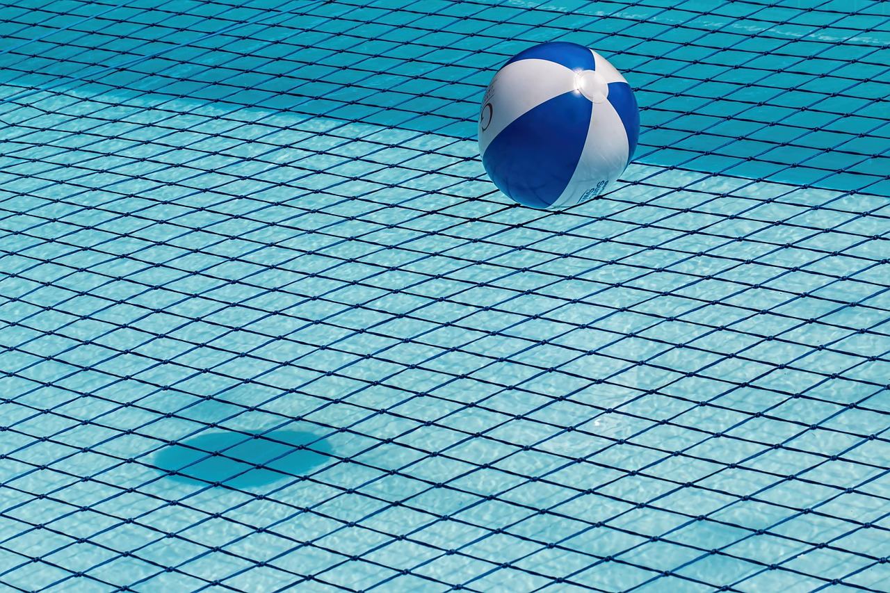 Clean blue swimming pool water with a pool edge